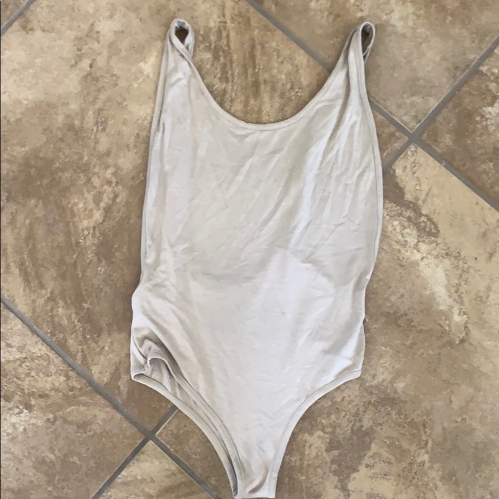 Tan leotard with low back